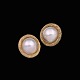 Danish 14k Gold 
Ear Clips with 
Pearl.
Stamped with 
585.
Diam. 1,7 cm. 
/ 0,67 inches.
Weight ...