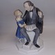B&G porcelænsfigur med H. C. Andersen, der læser for lille pige