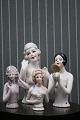 Fine, old porcelain half dolls.
Has been used as a top on old pincushions...