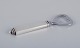 Georg Jensen 
Pyramid.
Bottle opener 
in sterling 
silver and 
stainless 
steel.
Hallmark: 
After ...