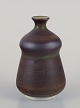 John Andersson 
(1899-1969) for 
Höganäs, 
Sweden. Unique 
ceramic vase.
Glaze in 
brown-green ...