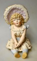 German 
cold-painted 
bisquit figure 
of a seated 
little ...