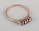 M. P. 
Christoffersen, 
Danish 
goldsmith. 
Classic gold 
ring adorned 
with three 
semi-precious 
...