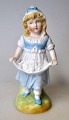 Bisquit vase 
med pige figur, 
Tyskland, 19. 
årh. 
Koldbemalet i 
pastel farver. 
H: 15 cm. B: 9 
...