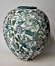 Danish ceramist 
(20th century), 
Vase. Vase in 
porcelain with 
decoration of 
leaves and 
flowers. ...