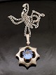Sterling sølv 
stjerne vedhæng 
D. 3,5 cm med 
aquamarin og 
sterling sølv 
kæde 44 cm. fra 
sølvsmed ...