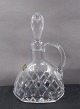 Oval carafe of 
crystal with 
grindings and 
the original 
stopper. 
The carafe is 
in a good ...