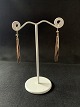 These gold 
earrings are 
beautiful and 
stylish in 
their 
expression. The 
long rods that 
hang from ...