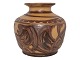 Kähler art 
pottery small 
brown vase.
Height 9.5 
cm., width 9.5 
cm.
There are a 
few small ...