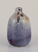 Royal 
Copenhagen. 
Unique ceramic 
vase. 
Test glaze in 
purple shades. 
Marked with 
three blue ...