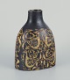 Nils Thorsson 
for Aluminia.
"Baca" vase 
with motif of 
birds.
Shades of 
ochre and ...