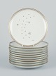 Bing and 
Grondahl, 
”Mælkevej” 
(“Milky Way”). 
A set of 
eleven plates. 
Gold 
decoration.
Circa ...