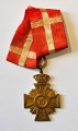 Militært 
hædertegn, 16 
år i tjeneste, 
20. årh. 
Danmark. 
Anvendt i Kong 
Christian X's 
tid. H: 4,6 ...