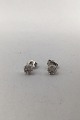 Bent Sørensen 
14K Gold 
Earrings with 
Diamonds 
Measures Diam 
0.5 cm Combined 
weight 1.0 gr. 
(0.04 oz)