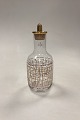 Holmegaard 
Crystal 
Christmas 
Karaffel fra 
2002 med 
dekorationer i 
guld, rød og 
hvid. Designet 
af ...