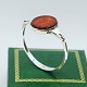 N. E. From silver jewellery.N. E. From; A bangle of sterling silver set with amber.Inner ...
