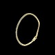 Tennisarmbånd i 
18k guld med 
brillanter.