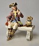 Tysk fajance 
figur, 19. årh. 
Jæger på en 
bænk med en 
hund. Nummeret: 
I 735. Polykrom 
dekoration. ...