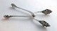 Georg Jensen. 
Sølv (925). 
Dronning. 
Istang. Længde 
14 cm.