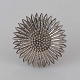Filigran broche 
i sølv med 
motiv af 
marguerit 
blomst
Producent 
ukendt
Ikke ...