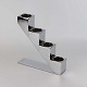 Lysestage til 
fire fyrfadslys 
i krombelagt 
stål. Model 
Lighting Stairs 
- også kendt 
under navnet 
...