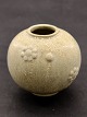 Arne Bang. 
Spherical vase 
of stoneware 
modeled with 
flowers in 
relief, 
decorated with 
light ...
