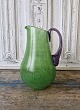 Kosta Boda jug 
in grass green 
glass with 
twisted purple 
...