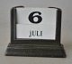 Andersen, Just 
(1884 - 1943) 
Danmark: 
Kalenderholder. 
Diskometal. No. 
2314. Stemplet. 
H.: 6,5 ...
