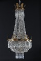 Stor slank 
antik 
prismelysekrone
Stor 
prismelysekrone 
i empire stil 
fra ca. år 1900
Behængt ...