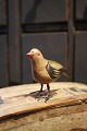 Decorative, old Swedish bird in painted wood with metal legs...