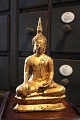 Gammel 
orientalsk buda 
i forgyldt 
jern. H: 
22,5cm.
( 2 stk. haves 
)