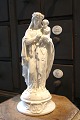 Fine, old Madonna figurine with the baby Jesus on her arm in white porcelain 
with many fine details...
