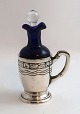 Danish work. 
Small oil 
bottle with 
silver cup. 
Height ...