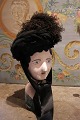 Old French vintage hat from around 1840 in black with tulle, beads and feathers 
and ribbon.