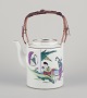Chinese porcelain teapot.Bamboo handle.Hand-painted motif of women in a landscape.Circa ...
