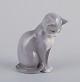 Royal 
Copenhagen. 
Porcelænsfigur 
af siddende 
kat.
Underglasur.
Fra Royal 
Copenhagen ...