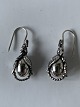 Georg Jensen 
sterlingsølv 
Heritage 
Årssmykke 2023, 
øreringe. 
De måler 3,3 x 
1,1 ...