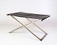 Skammel/taburet 
designet af 
Michael 
Christensen i 
1960’erne. 
Udført i sort 
læder med stel 
i ...