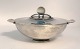 Georg Jensen. 
Sterling (925). 
Bowl with lid. 
Design: Harald 
Nielsen. Model 
689. Diameter 
without ...