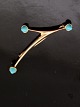 14 karat guld 
moderne broche 
med turkiser 6 
x 1,8 cm. 
stemplet 585 
Finnland emne 
nr. 611734