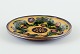 Kähler, 
Denmark.
Dish/wall 
relief made of 
ceramic with 
floral motif. 
Glaze in green 
and black ...