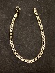 9 karat guld 
armlænke 18 cm. 
B. 0,38 cm. 
stemplet 375 
emne nr. 613979