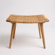 A classic Danish design stool from the 1960s with a frame made of teak and a seat in sage ...