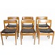 Set of six 
dining chairs 
made of teak 
with seats in 
original 
upholstered 
black leather. 
The ...