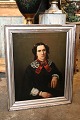 Old oil 
painting from 
the mid-19th 
century, 
portrait of a 
woman. 
The painting 
is framed in an 
...