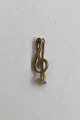 Georg Jensen 
18K Gold Brooch 
Clef  Measures 
2.5 cm (0.98 
inch) Weight 
2.54 gr (0.09 
oz)