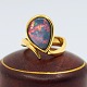 Georg Jensen; A 
ring in 18k 
gold set with a 
large opal
Opal: 15 mm x 
10 mm.
Stamped "G.J. 
& W ...