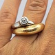 Ole Lynggaard; 
"Fidelity" ring 
of 14k gold and 
white gold, set 
with a 
brilliant-cut 
diamond, ...