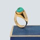 Ring of 14k 
gold, set with 
a turquoise. 
From around 
1970.
Turquoise L. 
1,2 cm. 
Ring size: ...