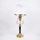 Antique 
kerosene lamp 
from the 1880s, 
manufactured by 
Fynsk Glasværk. 
The lamp is 
made of brass 
...